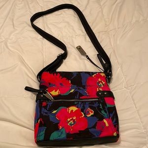 Rosetti multi color floral crossbody. Zippered compartment and front and back